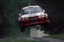 Tommi_Makinen_-_Risto_Mannisenmaki2C_Rally_1000_lagos_98_Mitsubishi_Lancer_Evo_V.jpg