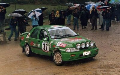 Fernando Capdevila - Alfredo RodrI­guez
25º Rallye de Portugal - Vinho do Porto 1991. Ford Sierra RS Cosworth 4x4 (10 MPE). Clasificado 13º.
Canarias Racing

Del 5 al 9 de Marzo, Portugal.
Superficie: asfalto - tierra.

El Rally tenia un total de 2041.26 Km de los que 564.20 Km divididos en 38 tramos eran especiales (2 de ellos fueron cancelados SS2 Gradil de 9 Km y SS28 Viseu de 29.90 Km).

Se inscribieron 106 equipos, tomaron la salida 95, finalizaron 28.@
Palabras clave: Ford;Sierra;Cosworth;Portugal;1991
