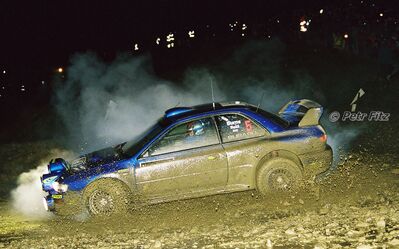 Richard Burns - Robert Reid
55º Network Q Rally de Gran Bretaña 1999. Subaru Impreza S5 WRC '99 (T 14 SRT). Clasificado 1º.

Del 21 al 23 de Noviembre, Cheltenham.
Superficie: tierra - asfalto.

El Rally tení­a un total de 1815.48 km de los que 389.39 km divididos en 22 tramos eran especiales.

Se inscribieron 186 equipos, tomaron la salida 160, finalizaron 89.

© Petr Fitz
@@
Palabras clave: Richard_Burns;Subaru;Impreza;Gran_Bretaña;WRC;1999