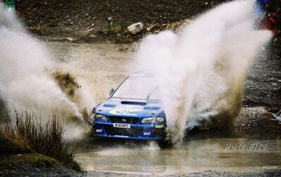Juha Kankkunen - Juha Repo
55º Network Q Rally de Gran Bretaña 1999. Subaru Impreza S5 WRC '99 (S 10 SRT). Clasificado 2º.

Del 21 al 23 de Noviembre, Cheltenham.
Superficie: tierra - asfalto.

El Rally tení­a un total de 1815.48 km de los que 389.39 km divididos en 22 tramos eran especiales.

Se inscribieron 186 equipos, tomaron la salida 160, finalizaron 89.

© Petr Fitz
@@
Palabras clave: ;Gran_Bretaña;Subaru;Impreza;WRC;1999