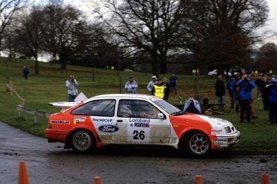 Carlos Sainz Cenamor - Antonio Boto
36º Lombard RAC Rally 1987. Ford Sierra RS Cosworth (V-7853-BX). Clasificado 8º.

Del 22 al 25 de Noviembre, Chester, Inglaterra.
Superficie: tierra.

El Rally tenia un total de 2623.92 Km de los que 513.29 Km divididos en 48 tramos eran especiales, (uno de ellos fue cancelado SS22 Hafren Forest 3 de 19.42 Km).

Se inscribieron 176 equipos, tomaron la salida 165, finalizaron 83.@
Palabras clave: ;Ford;Sierra;Cosworth;Gran_Bretaña;1987;RAC_Rally;Lombard;Inglaterra