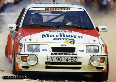 Carlos Sainz Cenamor - Antonio Boto
21º Rallye de Portugal Vinho do Porto 1987. Ford Sierra RS Cosworth (V-9614-BZ). Abandonó por el turbo en SS8 Freita de 24.20 Km

En su debut en una prueba del Mundial consiguieron 2 scratch, por delante de tracciones total como las de Markku Alén, Miki Biasion o Juha Kankkunen con los Lancia Delta HF 4WD.
SS1 Estoril de 13.10 Km (6' 27" a una media de 121.86 km/h) colocándose lideres de la prueba, y en SS6 Prestimo de 12.20 km (7' 57" a una media de 92.08 km/h).

Del 11 al 14 de Marzo, Estoril, Cascais, Lisboa, Portugal.
Superficie: asfalto - tierra.

El Rally tenia un total de 2,088.23 Km de los que 603.50 Km divididos en 37 tramos, eran especiales.

Tomaron la salida 94 equipos, finalizaron 36.
@
Palabras clave: ;Ford;Sierra;Cosworth;Portugal;1987