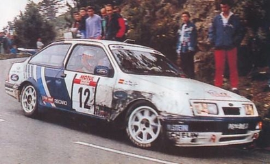 Carlos Sainz Cenamor - Luis Moya
32º Tour de Corse - Rallye de France 1988. Ford Sierra RS Cosworth (D323 TVW). Clasificado 5º.

Del 3 al 6 de Mayo, Ajaccio, Córcega, Francia.
Superficie: asfalto.

El Rally tenia un total de 1333.00 km de los que 622.84 km divididos en 30 tramos eran especiales.

Se inscribieron 93 equipos, tomaron la salida 93, finalizaron 42.@
Palabras clave: ;Luis_Moya;Ford;Sierra;RS;Cosworth;Còrcega;1988;Corse