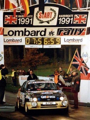 François Delecour - Daniel Grataloup
47º Lombard RAC Rally 1991. Ford Sierra RS Cosworth 4x4 (A1 FMC). Clasificado 6º.
Q8 Team Ford

Del 24 al 28 de Noviembre, Harrogate, Yorkshire, Inglaterra.
Superficie: tierra.

El Rally tenia un total de 2355.31 Km de los que 565,51 Km divididos en 37 tramos eran especiales.

Se inscribieron 160 equipos, tomaron la salida 151, finalizaron 82.@
Palabras clave: Ford;Sierra;Cosworth;Gran_Bretaña;RAC_Rally;Lombard;1991;Parque_Cerrado