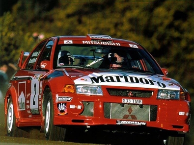 Marcus Gronholm - Timo Rautiainen 
33º TAP Rallye de Portugal 1999. Mitsubishi Carisma GT Evo VI (S33 TMR). Abandonó por la transmisión del coche en SS16 Arganil - Coja 1 de 20.96 Km.
Marlboro Mitsubishi Ralliart

Del 21 al 24 de Marzo, Matosinhos, Porto, Portuigal.
Superficie: tierra.

El Rally tení­a un total de 1768.61 km de los que 399.51 km divididos en 23 tramos eran especiales (dos de ellos fueron cancelados SS18 Arganil - Coja 2 de 20.96 km y SS19 Salgueiro - Gois 2 de 19.70 km).

Se inscribieron 117 equipos, tomaron la salida 117, finalizaron 56.@
Palabras clave: ;Mitsubishi;Carisma;Portugal;1999